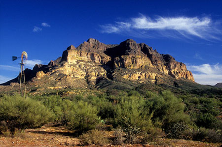 Abandoned windmill with Picketpost Mountain in the background